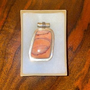 Stone pendant set in sterling silver